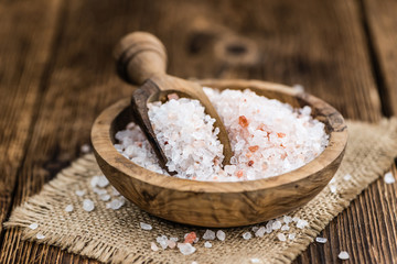 Wooden table with Pink Salt (selective focus)