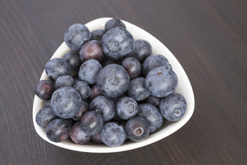 delicious blueberries in white bowl