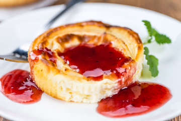 Cheesecake with berry Sacue (selective focus)