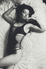 Naklejka premium View at attractive woman in the bed