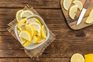 Fresh made Lemon Slices on a rustic background