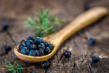 Juniper berries on old wooden table