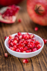 Wooden table with Pomegranate (selective focus)