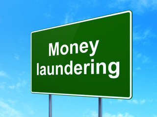 Money concept: Money Laundering on road sign background