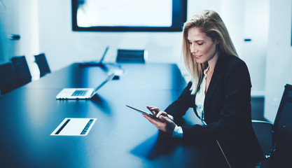 Businesswoman using tablet in conference room