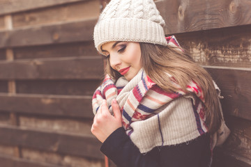 Pretty girl is wearing warm winter clothes