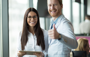Obraz premium Happy and confident colleagues looking for you