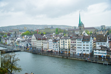 Fototapeta premium View of the historic city center of Zurich downtown with Fraumunster Church and on Limmat river, Zurich, Switzerland - April, 2016