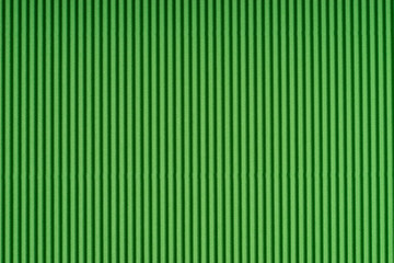 Striped green embossed paper. Colored paper. Verdant texture background