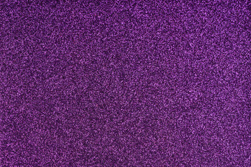 Glittering lilac paper sheet. Violet texture background. Sparkling purple pattern.