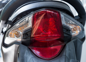 Red rear light of the modern motorcycle.