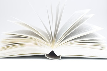 white book opened up against pure white background