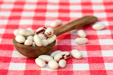 Beans on checkered tablecloth