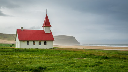 Fototapeta premium Winding road leading to the coast in Iceland in summer