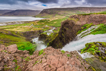 Mountain river flowing into the lake between the mountains, Iceland
