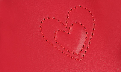 embroidery in shape of two hearts nested into each other, on pin