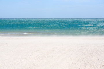 Fototapeta na wymiar Sea sand sky and summer day. Beautiful tropical beach. Beautiful beach and tropical sea. Seacoast