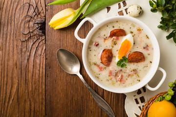 Traditional Polish white borsch with Easter decoration