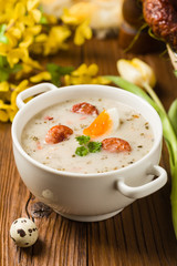 Traditional Polish white borsch with Easter decoration