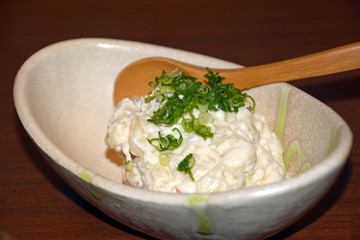 Delicious japanese cuisine, potato salad on a white bowl.