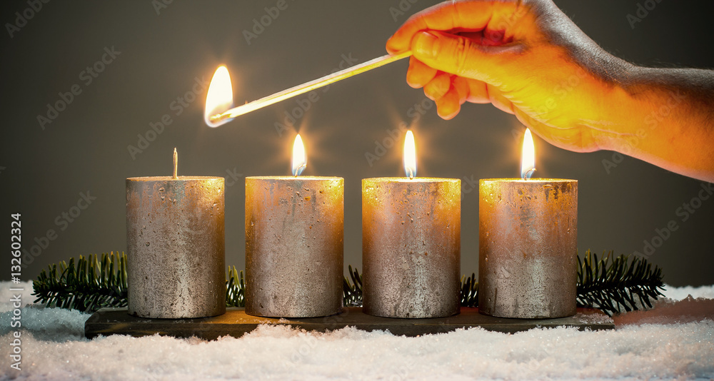 Wall mural Light four advents candles with matches