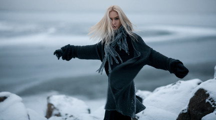 Fototapeta na wymiar Girl in snow on winter background.