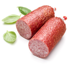 Salami smoked sausage and basil leaves isolated on white backgro