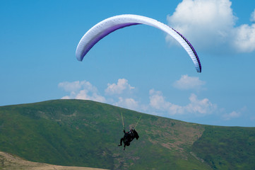 Paragliding over Carpathians. Paragliding over mountains.