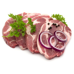 Raw pork neck chop meat with parsley herb leaves, peppercorn spi