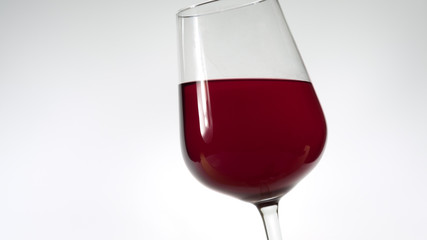 Isolated nice glass with red sweet wine on white background
