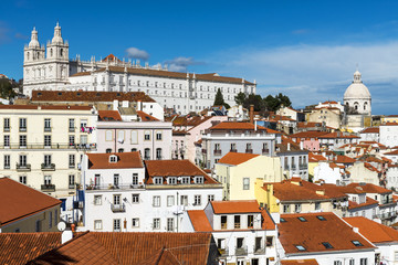 Fototapeta premium View of the Alfama Neighbourhood in Lisbon, Portugal, with colorful buildings and the National Pantheon