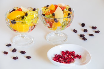 Colored dessert / sweet fruits and jelly in the bowl.