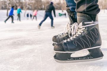 Close-up of ice skating shoes on a rink