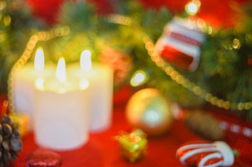 Christmas ornament and candles-defocused