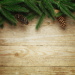 Christmas fir tree with decoration on a wooden board