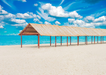 Beautiful tropical sandy beach with sun canopy