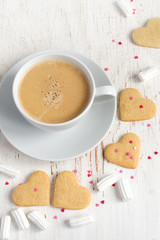 Cup of coffee and cookies for Valentine's Day
