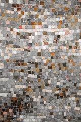 Vintage wall mosaic with neutral tone rough cut tiles
