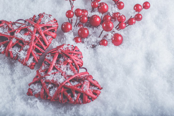 Two beautiful romantic vintage red hearts with mistletoe berries