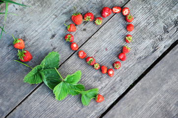 valenina day saint, heart laid out from berries of a ripe strawberry, space for text, sweet, bright, gentle, passionate, summer