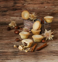 small round Christmas cakes with nuts and cinnamon, space for text