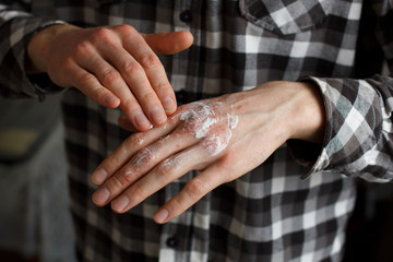 applying an emollient to dry flaky skin as in the treatment of psoriasis, eczema and other dry skin...