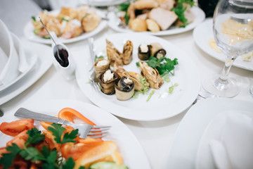 Table set for an event party or wedding reception. Food and drink