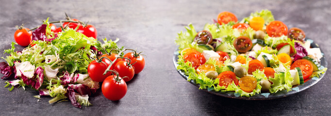 plate of fresh salad on dark background