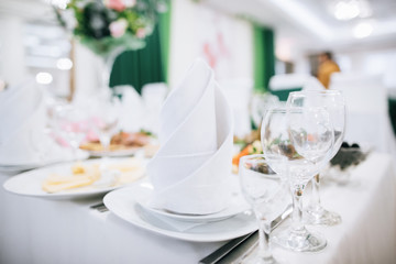 Table set for an event party or wedding reception. Food and drink