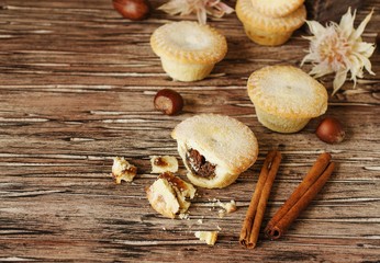 small round Christmas cakes with nuts and cinnamon, space for text