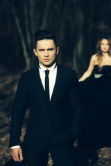 elegant young couple in forest