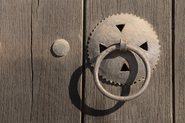 Old wooden vintage traditional door with lock, handles and hinges