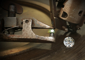 Faceting diamond, big gem with jewelery cutting equipment. Jewel