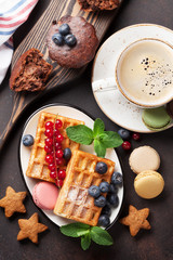 Coffee with waffles and sweets
